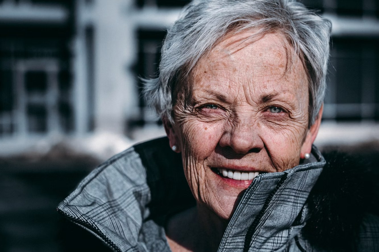 Smiling older woman — dentures at Dr Pierre Dentistry Edgecliff